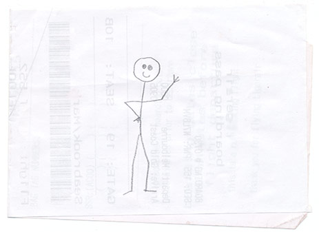 Stick figure sketch on a receipt